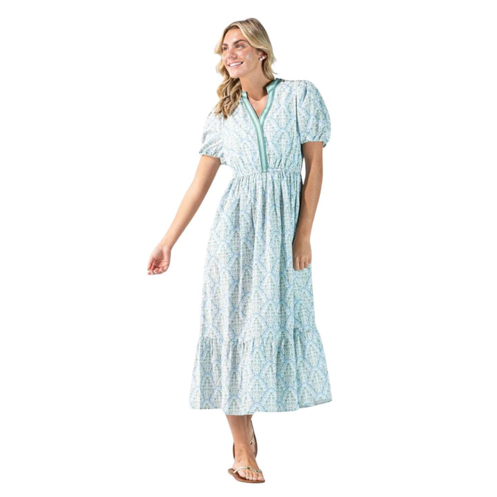 Woman wearing Simply Southern floral maxi dress in blue and mint with puff sleeves