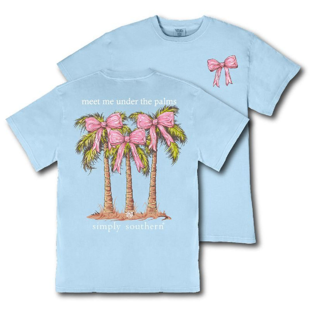 Light Blue T-shirt with palms trees graphic on the back and pink bow on the front.