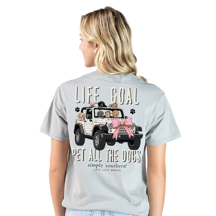 Woman wearing gray dog mom shirt showing Life Goal Pet All The Dogs Jeep graphic back view