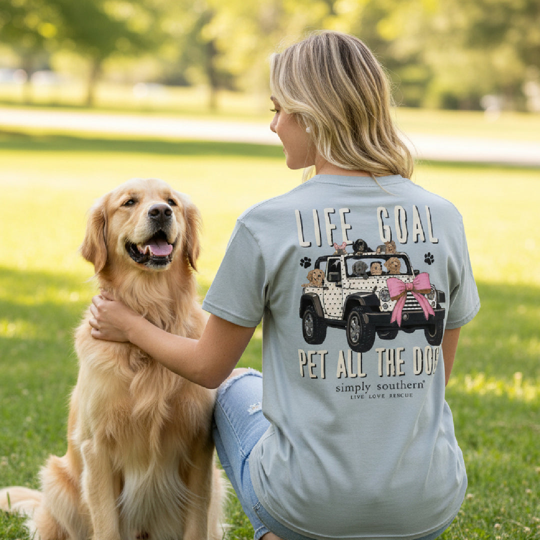 Woman in dog mom shirt petting golden retriever outdoors showing back graphic Pet All The Dogs