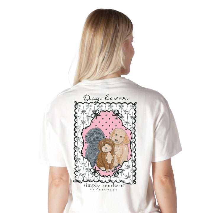 Woman wearing doodle dog shirt showing trio of doodles with bow border back graphic