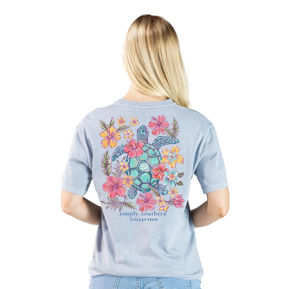 Woman wearing Simply Southern sea turtle shirt in mineral wash grey