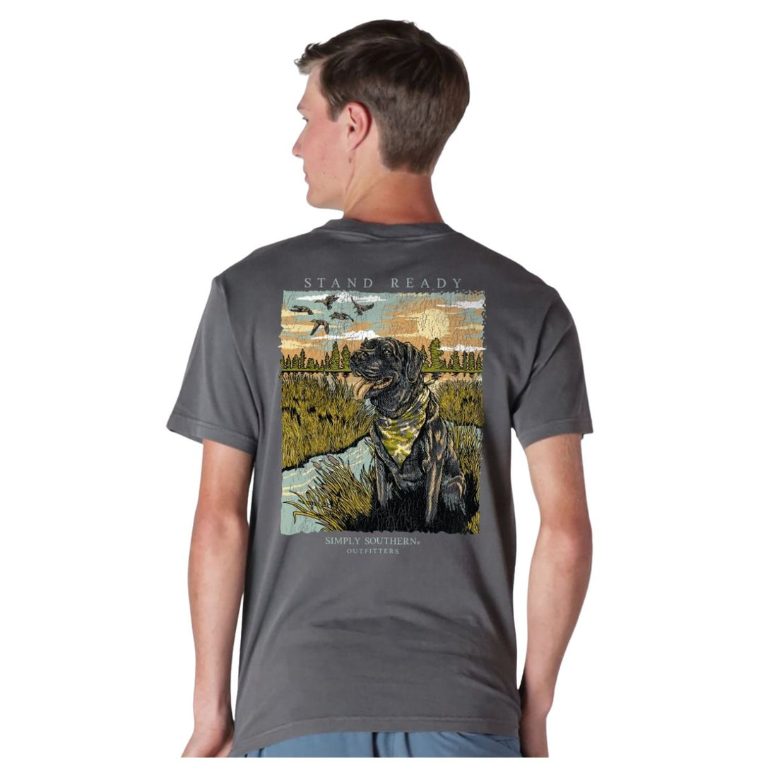 Man wearing a gray t-shirt with a graphic design on the back, featuring a black dog and text.