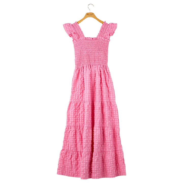 Pink maxi dress with smocked bodice, ruffle shoulders, and tiered skirt by Simply Southern