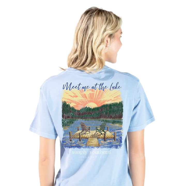Model wearing faded blue Simply Southern lake life tee with Adirondack chair sunset graphic