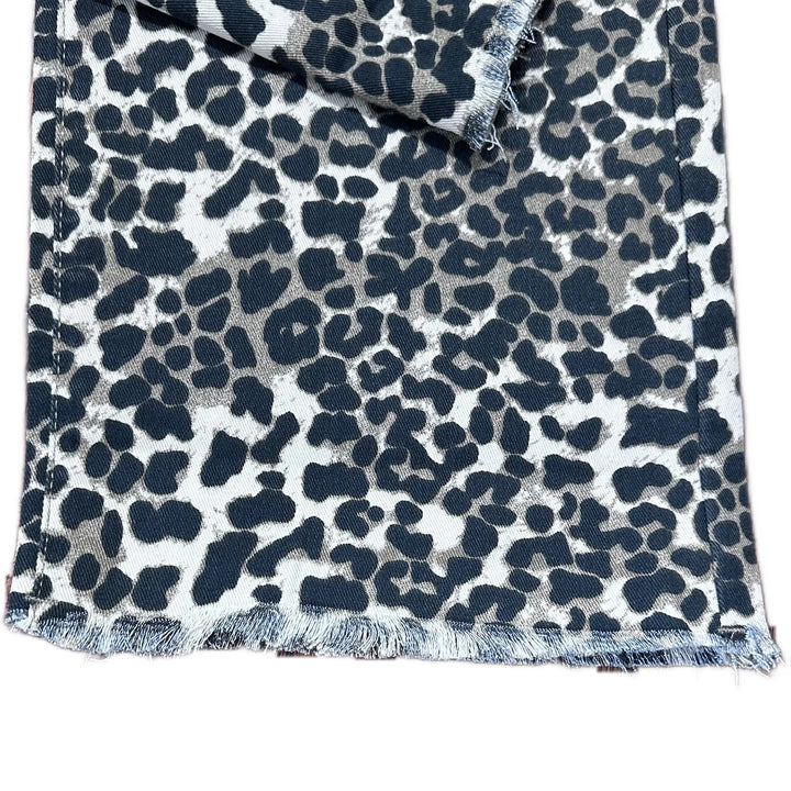 Fringe hem of Simply Southern Leopard print denim jeans in black, beige and cream