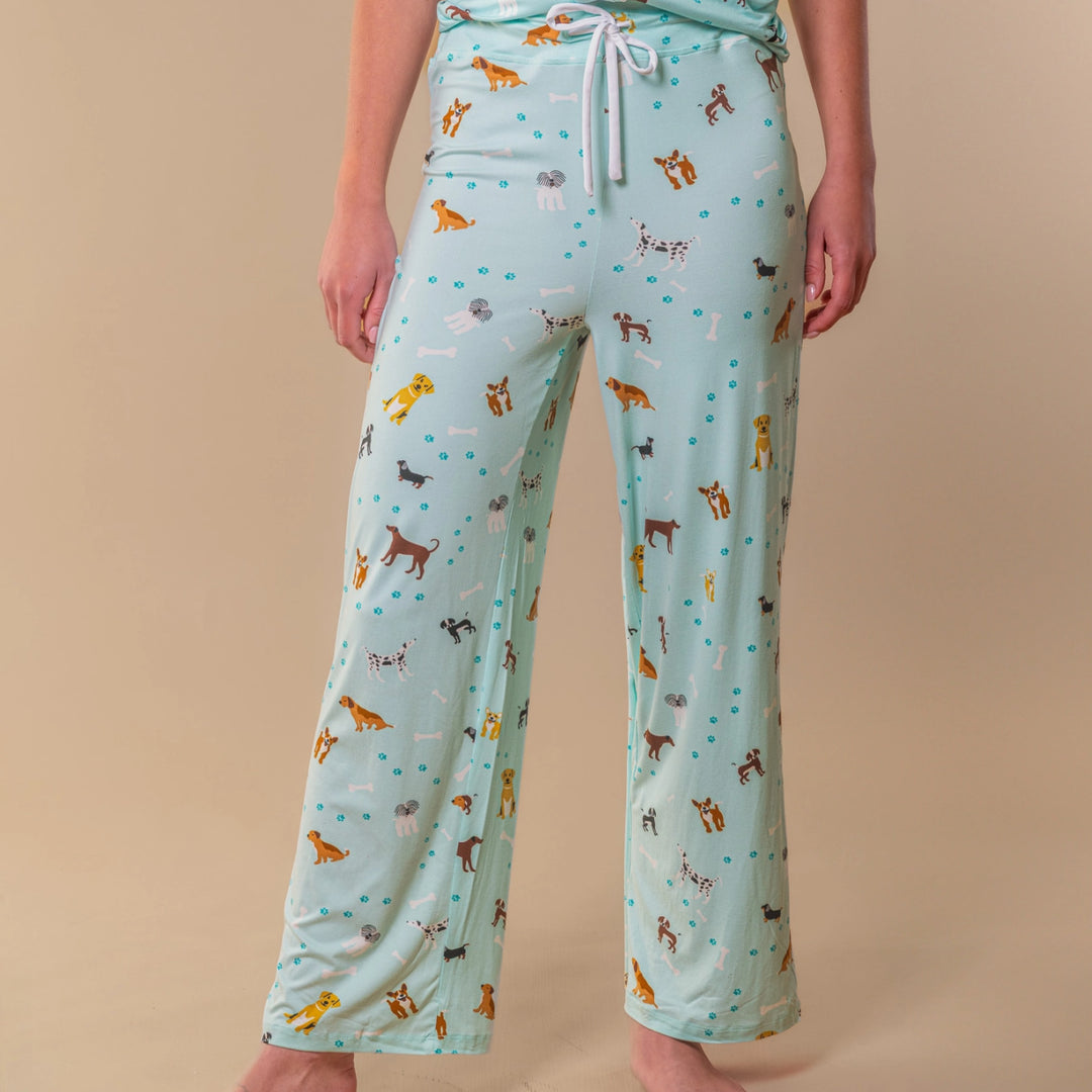 Model wearing mint green dog pajama pants with straight leg fit and drawstring waist