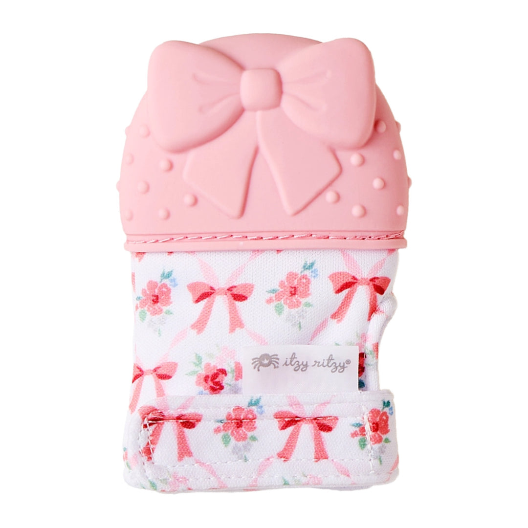 Pink bow teething mitten with silicone texture - Itzy Ritzy wearable teether for babies